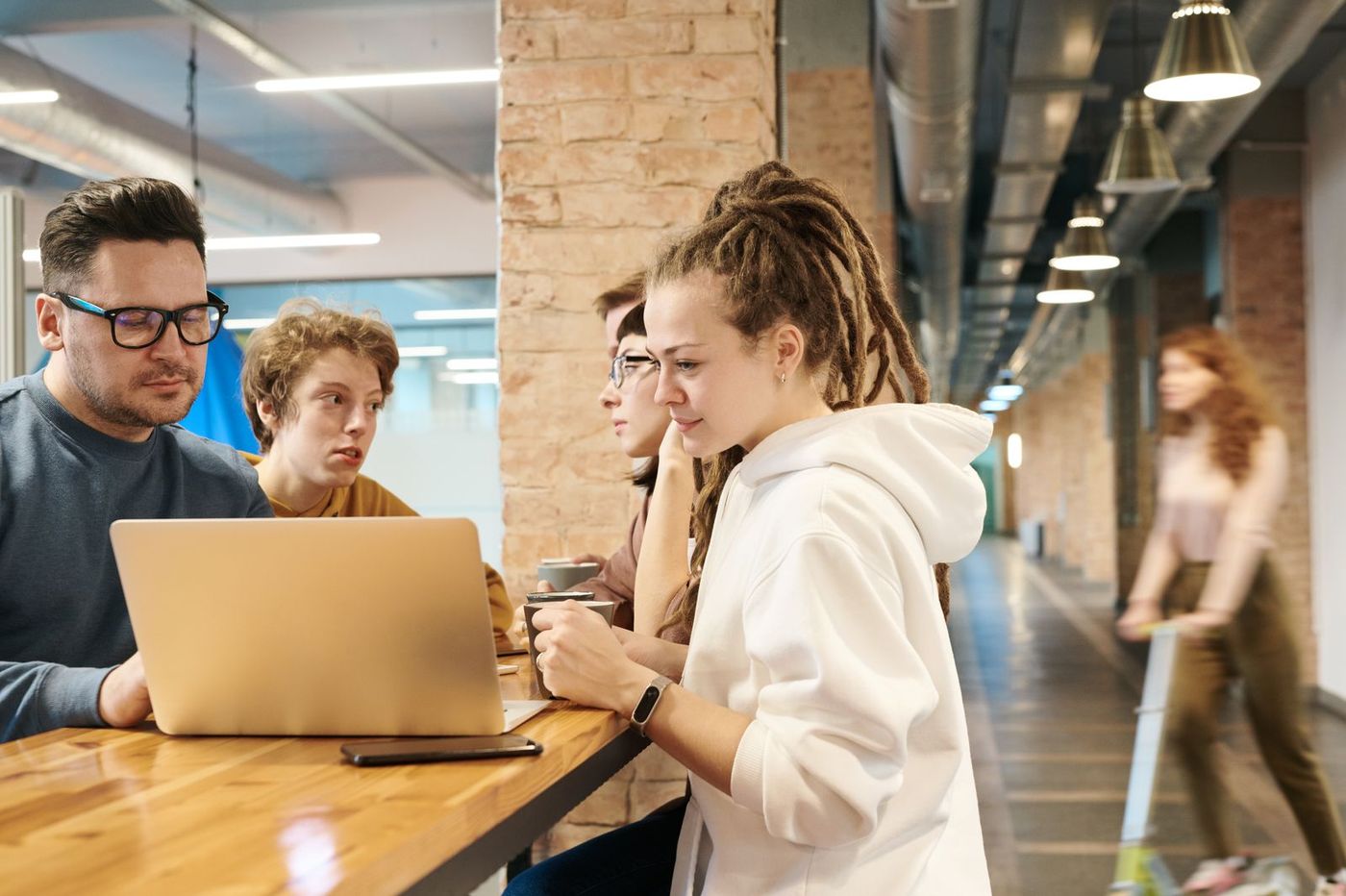 The Untax team in a bright workspace, candid, two or three people